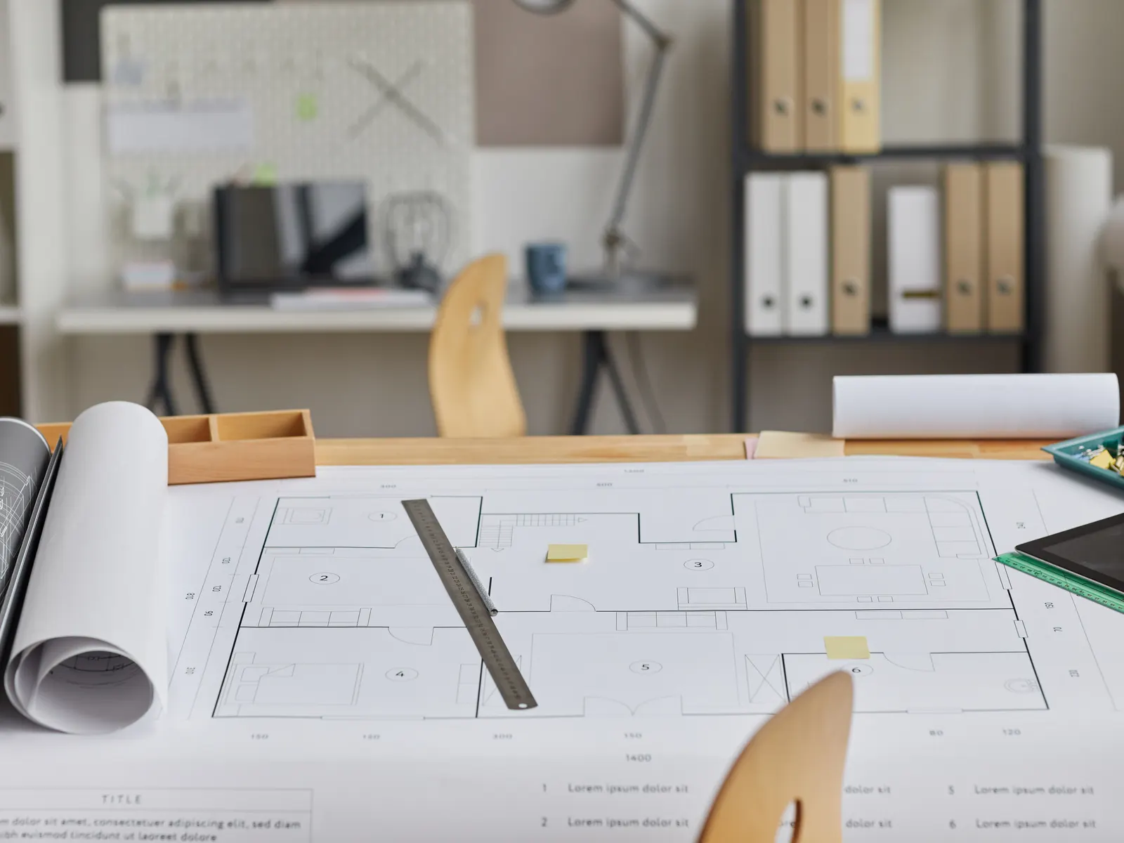 Plans and materials laid out on a table